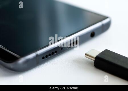 USB Type-C. usb-c cable and smartphone. close-up macro photography Stock Photo