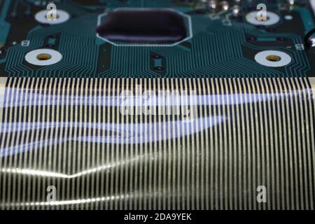 Electronic circuit board of an electronical calculator with many electrical components Stock Photo