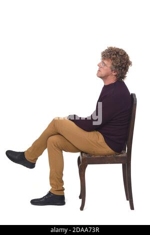 Side view of thinking man with crossed arms looking down. Full body ...