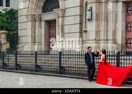 Qingdao / China - August 5th 2015: Wedding couple at St. Michael's Cathedral (Kathedrale St. Michael), a Catholic church built by German missionaries, Stock Photo