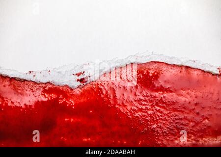 Polish flag made of torn pieces of paper. White and red paper strips. Symbol of divided nation. Stock Photo