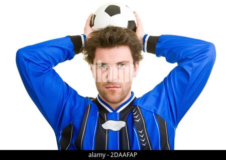 Young man in jersey with soccer ball Stock Photo