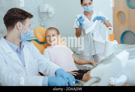 Fast and easy dental treatment with team Stock Photo