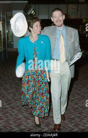 English Actor Anthony Andrews and wife Georgina Simpson at London Heathrow Airport June 1990 Stock Photo