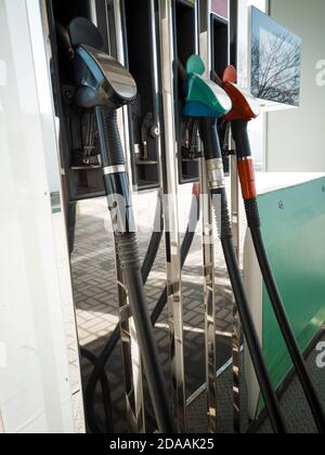 Gasoline column for refueling. Closeup guns for refueling at a gas station Stock Photo