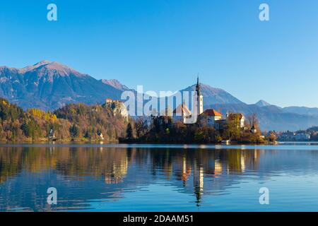 Magical autumn landscape with the island on Lake Bled (Blejsko jezero). Julian Alps, Slovenia, Europe. Stock Photo
