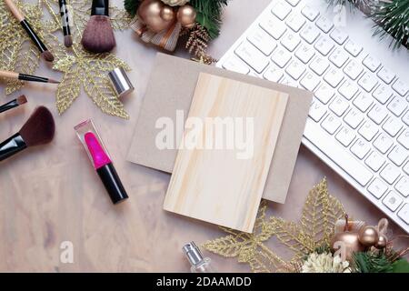 Mockup beauty Christmas New Year concept. Mock up blank empty space wood board with makeup cosmetic, Christmas decoration ornaments, New Year gifts on Stock Photo