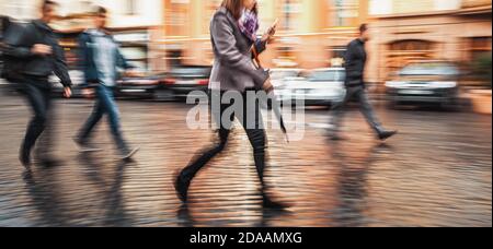 City life concept. People rushing in city. Abstract street scene in motion blur. Stock Photo