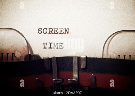 Screen time phrase written with a typewriter. Stock Photo