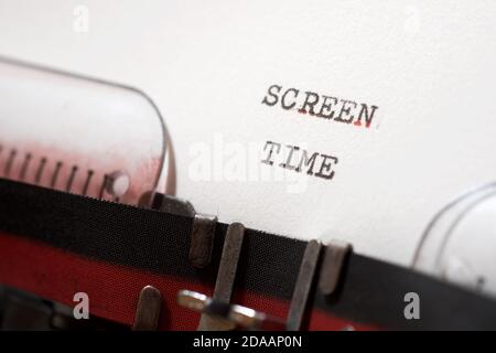 Screen time phrase written with a typewriter. Stock Photo