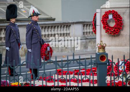 London, UK. 11th Nov, 2020. The senior officer on parade lays a wreath - A small service and 2 minutes silence at the Cenotaph. It is Remembrance Day and due to the second Coronavirus Lockdown, services of commemoration are greatly curtailed. Credit: Guy Bell/Alamy Live News Stock Photo