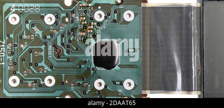 Electronic circuit board of a calculator with many electrical components. Isolated on white Stock Photo