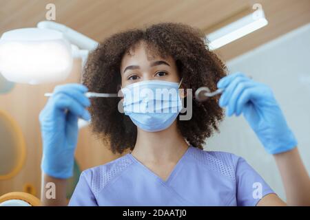 Caries prevention, modern medical examination and filling Stock Photo