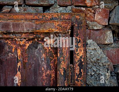 Old rusty door and brick wall Stock Photo