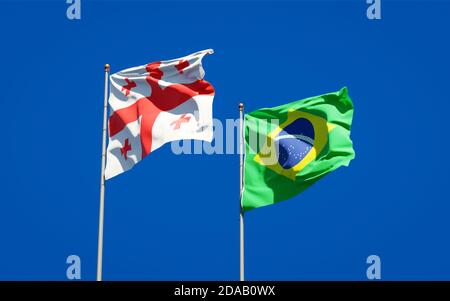 Beautiful national state flags of Georgia and Brasil together at the sky background. 3D artwork concept. Stock Photo