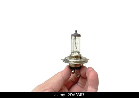 hand holding car halogen light bulb vehicle spare parts on white background Stock Photo