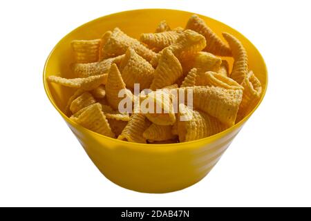 Walkers Bugles cheese flavour corn snack in colourful yellow bowl isolated on white background Stock Photo