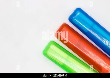 Colourful travel toothbrushes on a white background Stock Photo