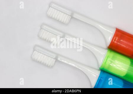 Colourful travel toothbrushes on a white background Stock Photo