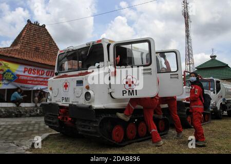 A Indonesian Red Cross officer check a Hagglunds vehicles during preparation disasters evacuation in Mount Merapi, Yogyakarta, 11 November 2020. The Hagglunds vehicle will be used for evacuation when Mount Merapi eruption. (Photo by Devi Rahman / INA Photo Agency / Sipa USA) Stock Photo