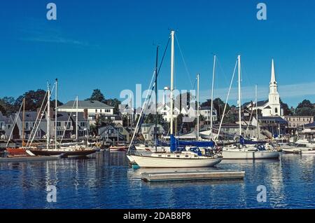 The charming coastal seaport of Camden, Maine, USA, is the iconic New England town with its white steepled church and a harbor full of modern and classic sailboats. These include historic schooners that offer sailing trips in Penobscot Bay and along the northeastern shores on the Atlantic Ocean. Stock Photo