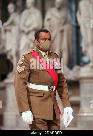 Colour Sergeant Johnson Beharry VC arrives at the High Altar during a service to mark Armistice Day and the centenary of the burial of the unknown warrior. Stock Photo