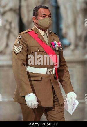 Colour Sergeant Johnson Beharry VC arrives at the High Altar during a service to mark Armistice Day and the centenary of the burial of the unknown warrior. Stock Photo
