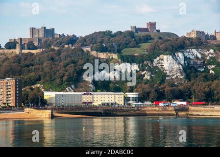 Dover, Kent, England, UK. 2020. View from the western docks of Dover Castle and White Cliffs and hotel on the beach. Stock Photo