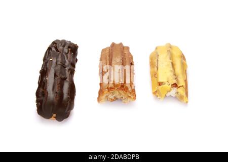 High angle shot of three different types of eclairs isolated on white background Stock Photo