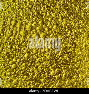 Huge quantity of yellow air bubbles in liquid. Stock Photo
