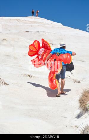 Man (Not recognizable) with inflatable lobster Stock Photo