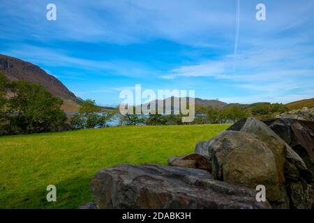 Looking over a dry stone wall to Crummock Water from Rannerdale Fell Lake District National Park Cumbria England UK United Kingdom GB Great Britain Stock Photo