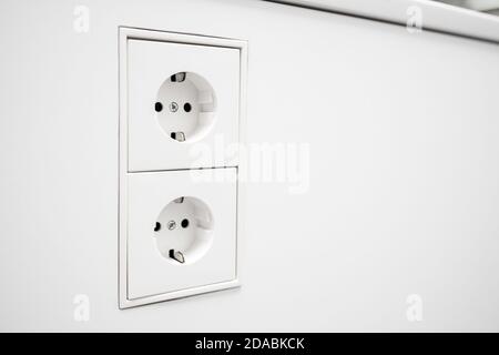 Electrical jack white plastic socket. Copy space Stock Photo