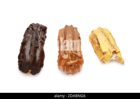 Three eclairs with different creams isolated on a white background Stock Photo