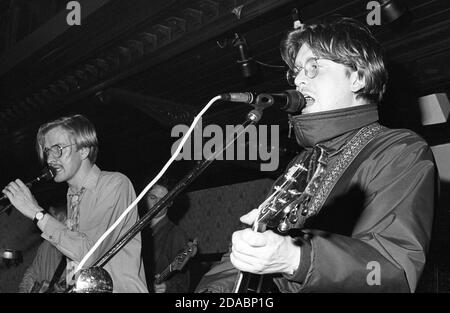 Monochrome image of Duglas T. Stewart, Gerard Love and Norman Blake of Glasgow indie band BMX Bandits performing at Esquires, Bedford, UK, in 1990. Stock Photo