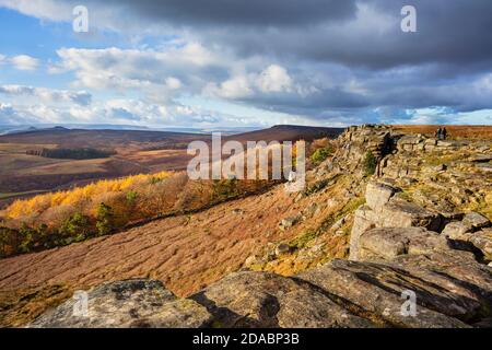 Walkers in the distance on Stanage Edge near Hathersage Derbyshire Peak District National Park Derbyshire England UK GB Europe Stock Photo