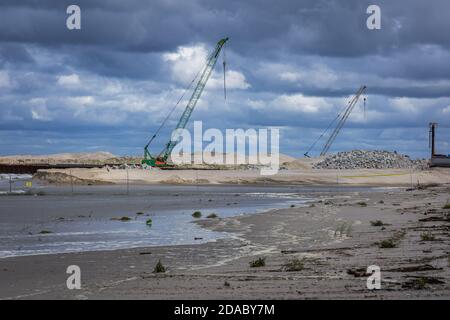 Cranes on Vistula Spit canal building site - connection between the Vistula Lagoon and Gdańsk Bay, Poland Stock Photo