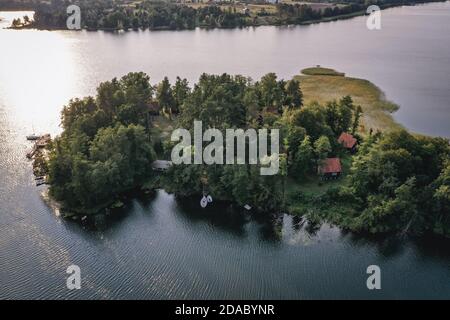 Island on Narie Lake located in Ilawa Lakeland region, view from Kretowiny village, Ostroda County, Warmia and Mazury province of Poland Stock Photo