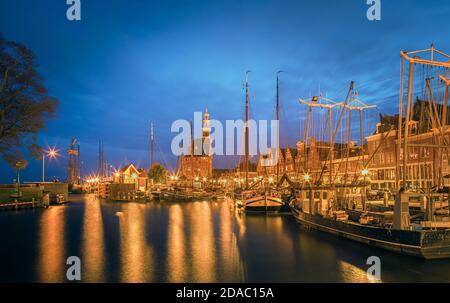 Twilight in the town of Hoorn, North-Holland, with in the background the Hoofdtoren near the harbour. The Hoofdtoren is one of the last defenses in Ho Stock Photo