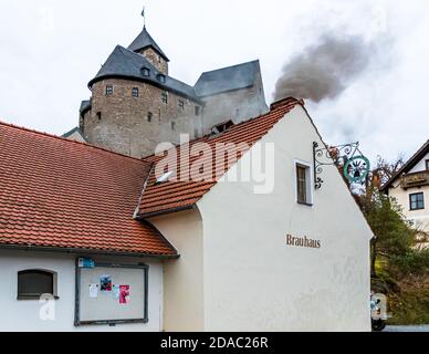 The chimney smokes above the traditional Zoigl Brewery in Falkenberg, Germany