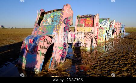 Cadillac Ranch is a public art installation and sculpture in Amarillo, Texas. It was created in 1974 by Chip Lord, Hudson Marquez and Doug Michels. Stock Photo