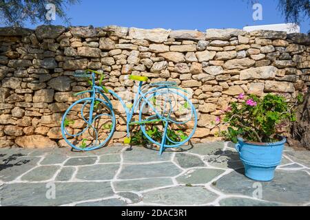 Decorative bicycle parked on street in the town of Chora on the island of Folegandros. Cyclades, Greece Stock Photo