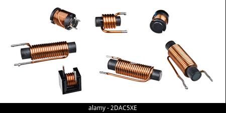 Set of solenoid induction coils with black ferrite core isolated on white background. Close-up of cylindric inductors with helical copper wire winding. Stock Photo