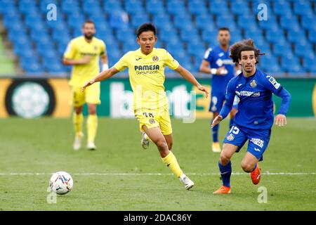 Takefusa Kubo of Villarreal and Marc Cucurella of Getafe in action during the Spanish championship La Liga football match between Getafe CF and Vill P Stock Photo