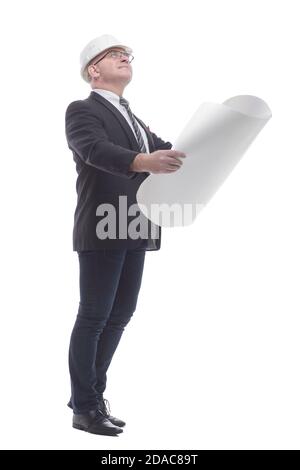 side view. smiling architect reading a new drawing. Stock Photo