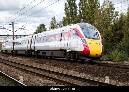 DONCASTER, UK - OCTOBER 15, 2020. A Hitachi Azuma Class 800 diesel electric passenger train on the east Coast Main Line Stock Photo