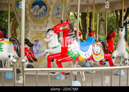 Fragment of Merry-go-round carousel with horses Stock Photo