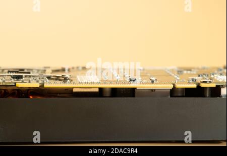 edge of pci express 16x connector of modern video card for personal computer Stock Photo