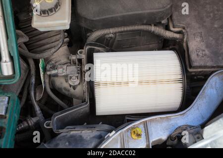 New clean air filter for vehicle engine is mounted in plastic box, close up view Stock Photo