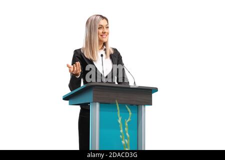 Young businesswoman giving a speech on a pedestal isolated on white background Stock Photo